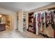 Walk-in closet that connects to the Primary bathroom with custom storage solutions and ample space at 902 Dianne Dr, Boulder City, NV 89005