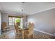 Elegant dining room with hardwood floors, decorative chairs, and a stylish chandelier at 902 Dianne Dr, Boulder City, NV 89005