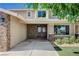 Inviting home entrance with double doors, stone accents, and manicured landscaping at 902 Dianne Dr, Boulder City, NV 89005