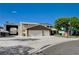 Spacious home with a large three-car garage, RV parking, and well-manicured landscaping at 902 Dianne Dr, Boulder City, NV 89005