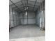 Spacious metal garage perfect for storage or workshop, featuring concrete floors and ample lighting at 902 Dianne Dr, Boulder City, NV 89005