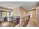 Upstairs hallway with laundry area and staircase, providing functionality and convenience at 902 Dianne Dr, Boulder City, NV 89005