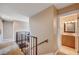 Upstairs hallway area with a railing and view of a bathroom with vanity at 902 Dianne Dr, Boulder City, NV 89005