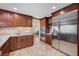 Updated kitchen with stainless steel appliances and elegant dark wood cabinetry at 902 Dianne Dr, Boulder City, NV 89005