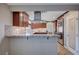 Open kitchen design with bar seating and views into the adjacent cooking area at 902 Dianne Dr, Boulder City, NV 89005
