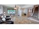 Cozy living room showcasing hardwood floors, a staircase, and a bright window view at 902 Dianne Dr, Boulder City, NV 89005