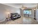 Comfortable living room with hardwood floors, ceiling fan, and ample natural light at 902 Dianne Dr, Boulder City, NV 89005