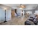 Large open-concept living space with hardwood floors, staircase, and modern decor at 902 Dianne Dr, Boulder City, NV 89005