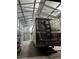 Large RV garage with metal framing, providing secure and covered storage for a motorhome at 902 Dianne Dr, Boulder City, NV 89005