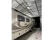 Spacious RV garage providing secure storage and shelter for a large recreational vehicle at 902 Dianne Dr, Boulder City, NV 89005