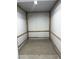Small metal and wood framed storage shed with tiled floor offering secure space at 902 Dianne Dr, Boulder City, NV 89005