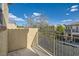 Outdoor balcony with metal railing offering neighborhood views and natural light at 9066 Hilverson Ave, Las Vegas, NV 89148
