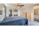 Bright bedroom showcasing two dressers, ceiling fan and carpet floors at 9066 Hilverson Ave, Las Vegas, NV 89148
