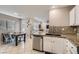 Open kitchen with stainless steel appliances and granite countertops at 9066 Hilverson Ave, Las Vegas, NV 89148