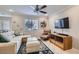 Comfortable living room featuring recessed lights, ceiling fan, and plush sofa at 9066 Hilverson Ave, Las Vegas, NV 89148