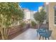 Inviting patio with tiled flooring, seating, and privacy wall landscaping at 9066 Hilverson Ave, Las Vegas, NV 89148