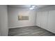 Comfortable bedroom showcasing window, closet, and wood-look flooring at 928 Rockview Dr # 102, Las Vegas, NV 89128