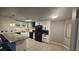 Bright kitchen featuring white cabinets and stainless steel appliances at 928 Rockview Dr # 102, Las Vegas, NV 89128