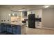 Updated kitchen with sleek black appliances, white cabinets, stylish countertops, and pendant lights at 928 Rockview Dr # 102, Las Vegas, NV 89128