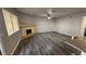Living room featuring fireplace, updated flooring, and ample natural light at 928 Rockview Dr # 102, Las Vegas, NV 89128
