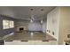 Spacious living room with fireplace and seamless transition to the updated kitchen at 928 Rockview Dr # 102, Las Vegas, NV 89128