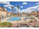 Beautiful community pool surrounded by lush landscaping and comfortable lounge chairs for residents at 928 Rockview Dr # 102, Las Vegas, NV 89128