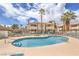 Inviting community pool with plenty of lounge chairs and a scenic view of the surrounding buildings at 928 Rockview Dr # 102, Las Vegas, NV 89128