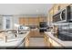 Modern kitchen featuring a large island, stainless steel appliances, and sleek countertops at 9671 S Conquistador St # Lot 18, Las Vegas, NV 89178