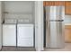 Convenient laundry area with washer, dryer, stainless refrigerator, and plenty of additional storage space at , Las Vegas, NV 89144