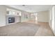 Bright living room with a cozy fireplace, neutral paint and carpeting, and tons of natural light at , Las Vegas, NV 89144