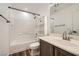 Bathroom featuring shower-tub combo, wood-look flooring and a modern vanity at 11913 Alava Ave, Las Vegas, NV 89138
