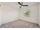 A well lit bedroom has carpeted floors, a ceiling fan, and a window with blinds at 11913 Alava Ave, Las Vegas, NV 89138