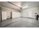 A spacious and clean garage is equipped with storage cabinets and epoxy floors at 11913 Alava Ave, Las Vegas, NV 89138