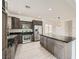 Updated kitchen featuring an island, stainless steel appliances, and granite countertops at 11913 Alava Ave, Las Vegas, NV 89138
