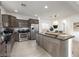 Stylish kitchen with stainless steel appliances, a large island, and sleek granite countertops at 11913 Alava Ave, Las Vegas, NV 89138