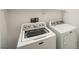 The laundry room includes a side-by-side washing machine and a dryer at 11913 Alava Ave, Las Vegas, NV 89138