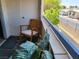 Balcony with a wooden rocking chair overlooking the neighborhood at 2725 S Nellis Blvd # 2083, Las Vegas, NV 89121
