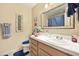 Cozy bathroom featuring a single sink vanity, a large mirror, and decorative touches at 2725 S Nellis Blvd # 2083, Las Vegas, NV 89121