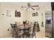 Charming dining area with a glass table, four chairs, and a ceiling fan at 2725 S Nellis Blvd # 2083, Las Vegas, NV 89121