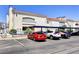 Exterior view of the condo building showcasing parking and landscaping at 2725 S Nellis Blvd # 2083, Las Vegas, NV 89121