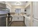 Charming kitchen with white cabinets, stainless steel appliances, and updated fixtures at 2725 S Nellis Blvd # 2083, Las Vegas, NV 89121