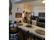 Eat-in kitchen with countertop seating, stainless steel appliances, and ample cabinet space at 2725 S Nellis Blvd # 2083, Las Vegas, NV 89121