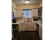 Bright kitchen with white cabinets, stainless steel appliances, and modern countertops at 2725 S Nellis Blvd # 2083, Las Vegas, NV 89121