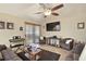 Relaxing living room features a ceiling fan, comfortable seating and wood laminate flooring at 2725 S Nellis Blvd # 2083, Las Vegas, NV 89121