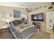 Inviting bedroom featuring a ceiling fan and a large television at 2725 S Nellis Blvd # 2083, Las Vegas, NV 89121