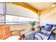 Covered patio with multiple seating options and a view of palm trees at 2725 S Nellis Blvd # 2083, Las Vegas, NV 89121