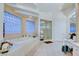 Bathroom with soaking tub and natural lighting at 3008 Astoria Pines Cir, Las Vegas, NV 89107