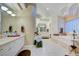 Luxurious bathroom with soaking tub and glass block window at 3008 Astoria Pines Cir, Las Vegas, NV 89107