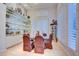 Bright dining room with glass table seating for six. Shelving with mirrored backsplash at 3008 Astoria Pines Cir, Las Vegas, NV 89107