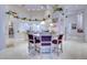 Bright, open kitchen with an island, bar seating, and modern appliances, perfect for entertaining at 3008 Astoria Pines Cir, Las Vegas, NV 89107